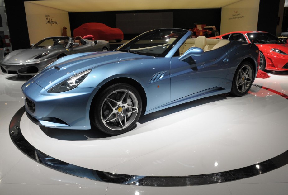 A light blue Ferrari California parked at the Paris autoshow is now a $100k used supercar.