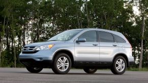 A silver-gray 2011 Honda CR-V EX-L with Navigation compact SUV model