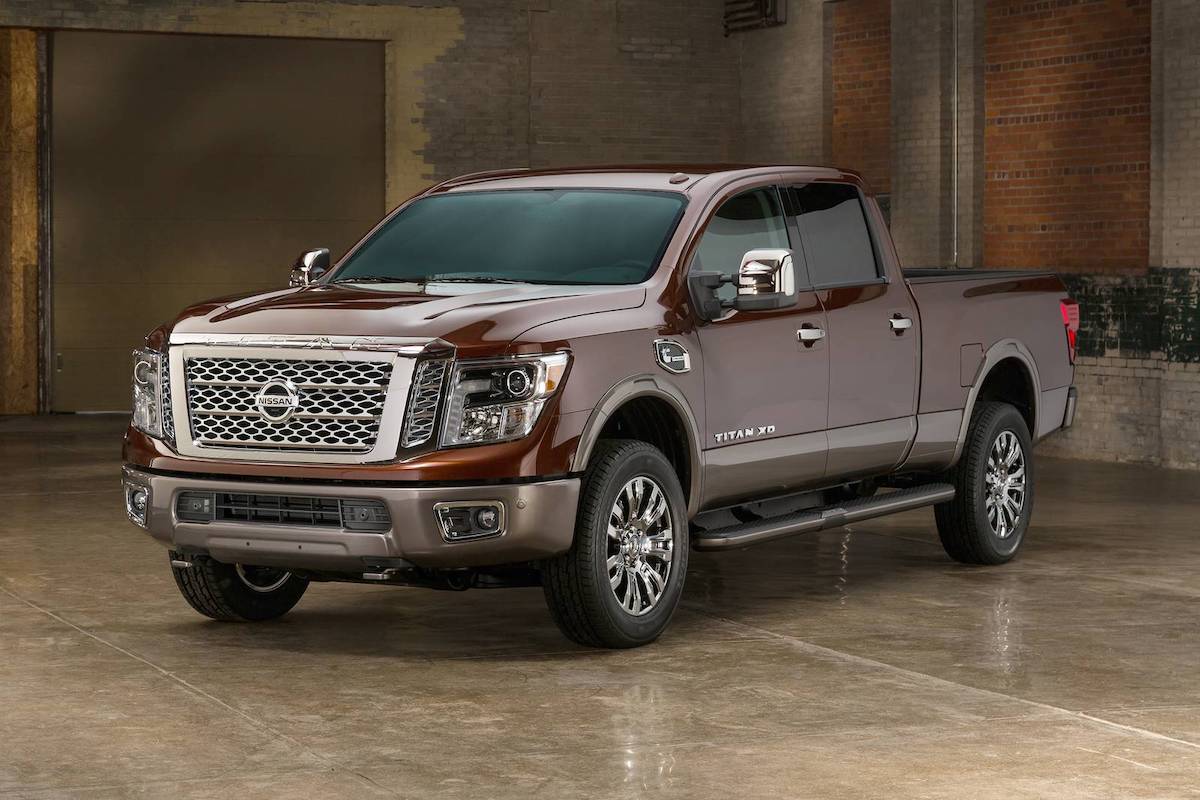 A Nissan Titan on display inside of a warehouse.