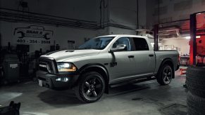 White Ram 1500 pickup truck parked in a garage because of common engine problems.