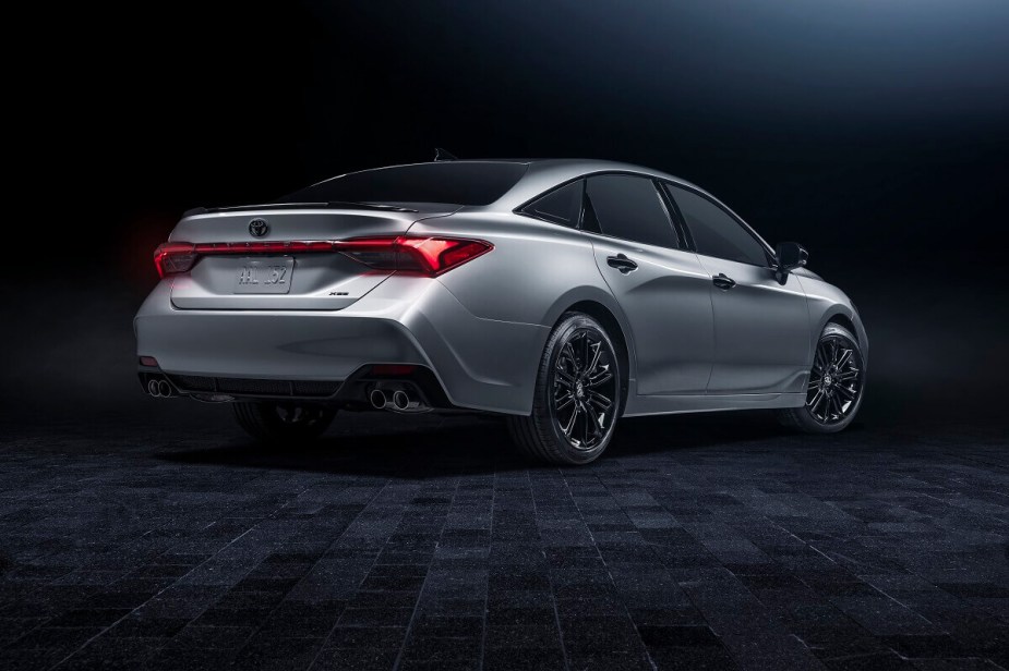 A used 2021 Toyota Avalon sedan shows off its rear styling and silver paintwork.