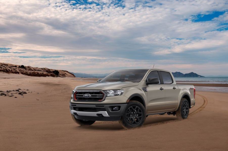 A tan 2022 Ford Ranger Splash Sand Edition midsize pickup truck model driving on a sandy beach