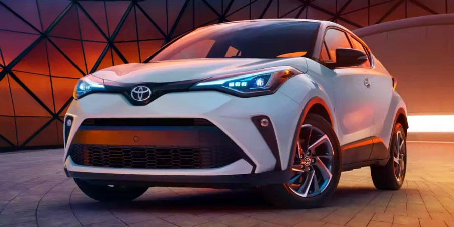 A white 2022 Toyota C-HR subcompact SUV is parked.