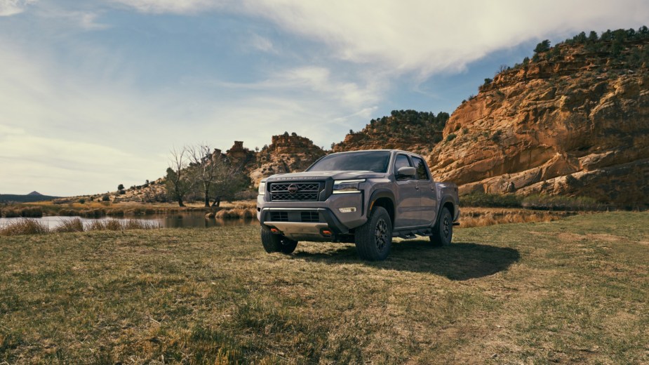 A 2023 Nissan Frontier sits in a remote location. It has a standard V6 powertrain.