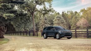 A 2023 Ford Explorer parked on a dirt road.