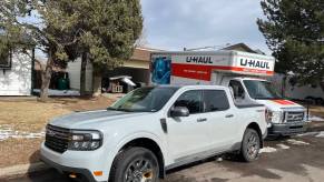 2023 Ford Maverick Tremor in front of a house with a moving truck