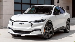 A white 2023 Ford Mustang Mach-E small electric SUV is parked.