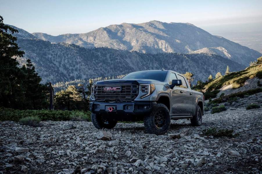 A 2023 GMC Sierra 1500 parked outdoors in front of a mountain.