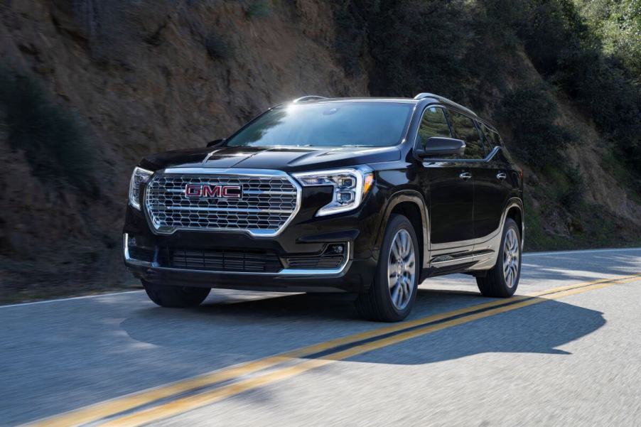 A 2023 GMC Terrain Denali compact crossover SUV model in the Ebony Twilight Metallic paint color option