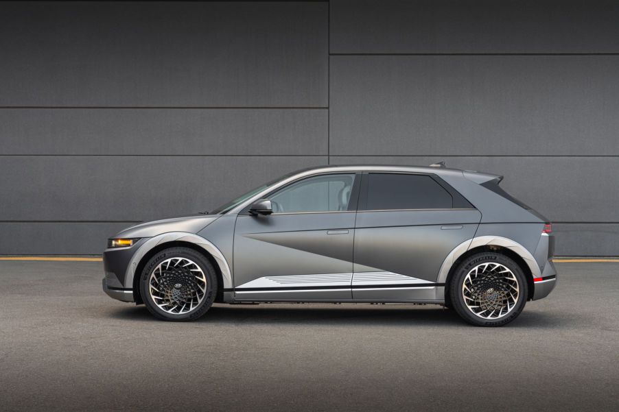 A side exterior profile shot of a silver-gray 2023 Hyundai Ioniq 5 all-electric (EV) compact SUV model