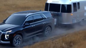 The 2023 Hyundai Palisade towing a trailer.