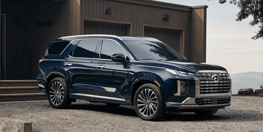 The 2023 Hyundai Palisade parked by a home