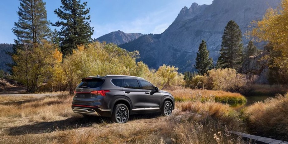 A gray 2023 Hyundai Santa Fe Hybrid midsize hybrid SUV is parked outdoors. 