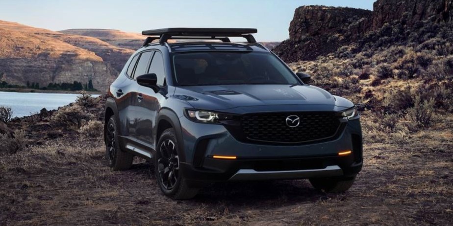 A blue 2023 Mazda CX-50 small SUV is parked outdoors. 