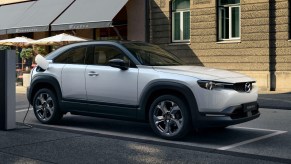 A white 2023 Mazda MX-30 EV subcompact SUV is parked.