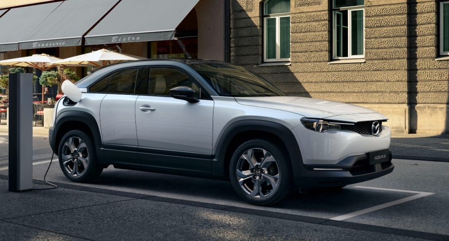 A white 2023 Mazda MX-30 EV subcompact SUV is parked.