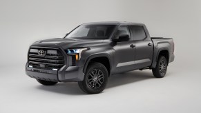 A silver 2023 Toyota Tundra in a white room.