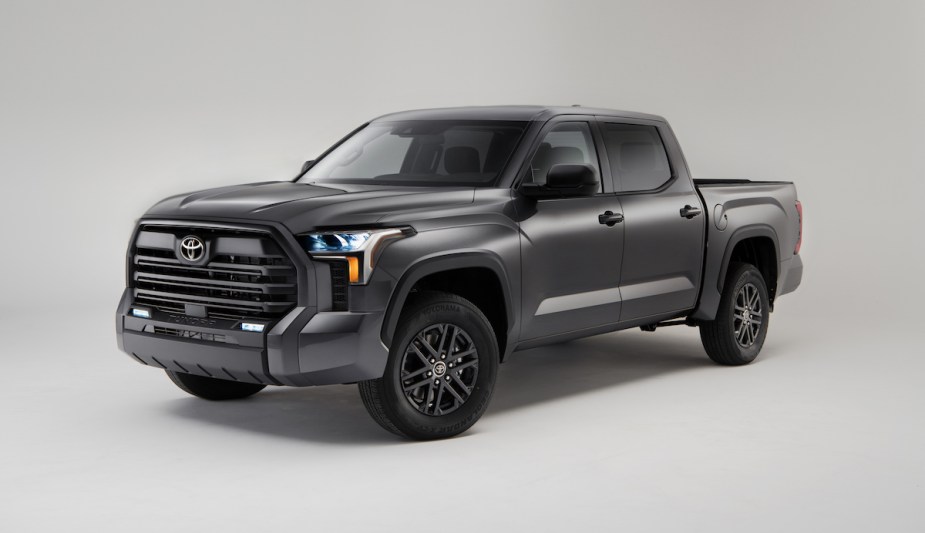 A silver 2023 Toyota Tundra in a white room. 