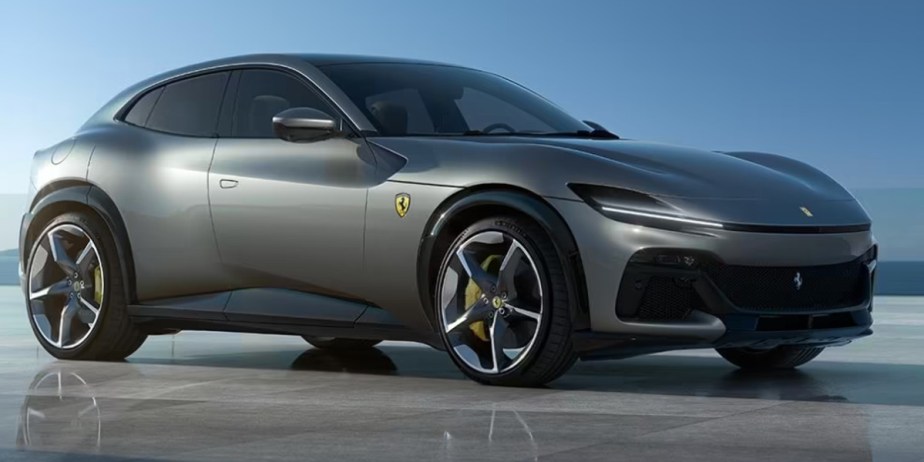 A gray 2024 Ferrari Purosangue small luxury performance SUV is parked. 