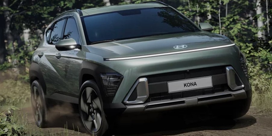 A green 2024 Hyundai Kona subcompact SUV is parked.