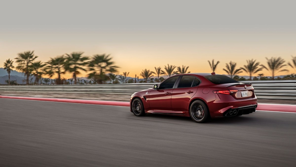 A red Alfa Romeo Giulia on track