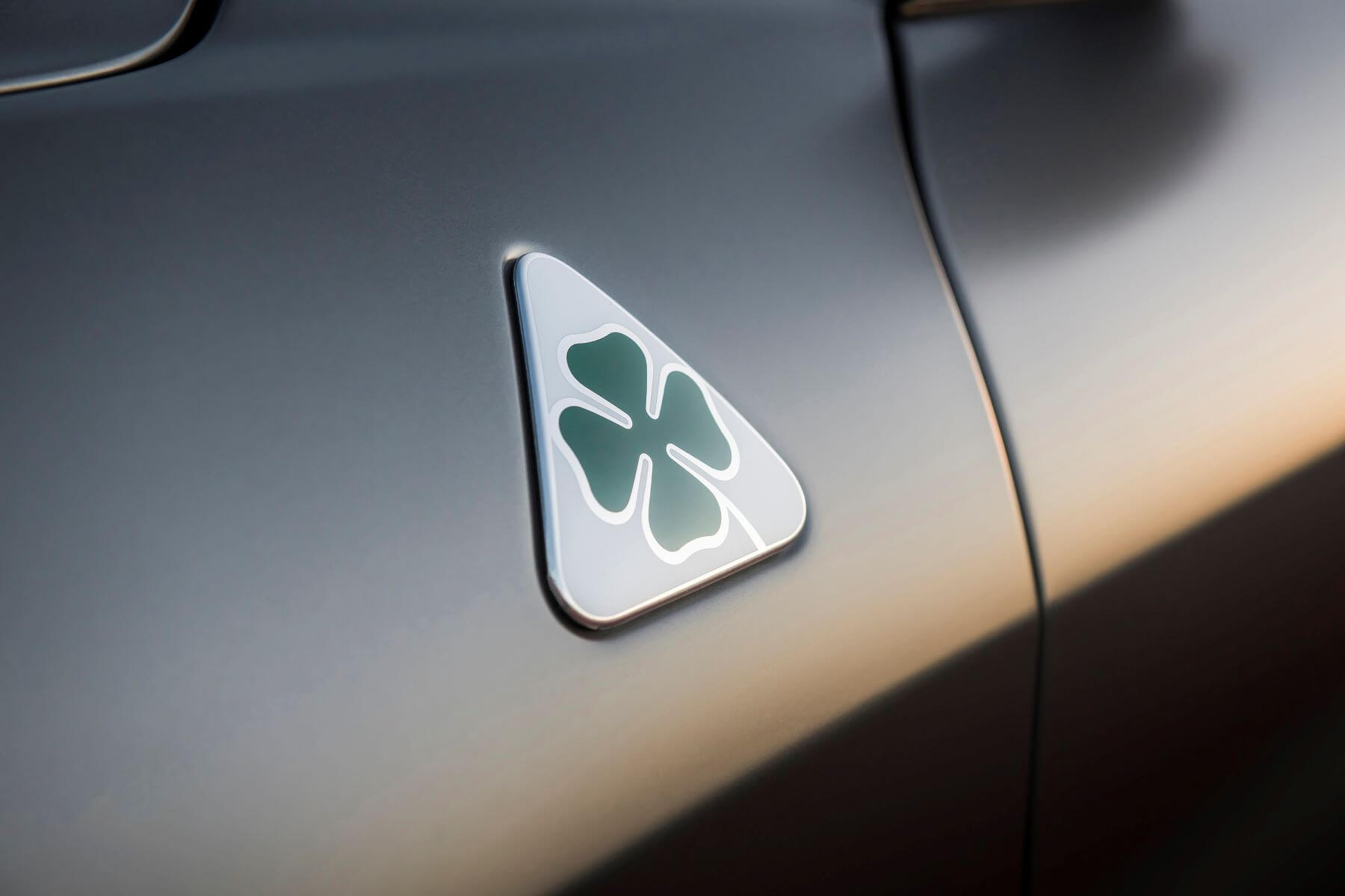 The Alfa Romeo Quadrifoglio badge on a Giulia sedan model