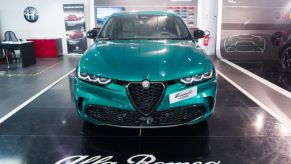 An Alfa Romeo Tonale on display at a dealership.