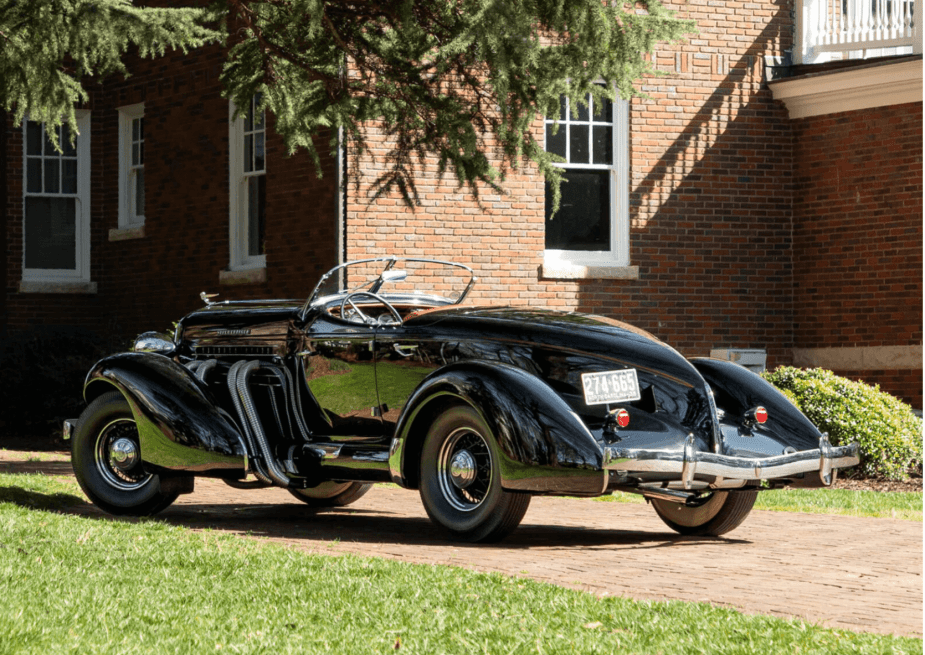 The rear end of a black Auburn Speedster, common thoght of as the most beautiful American car ever made.