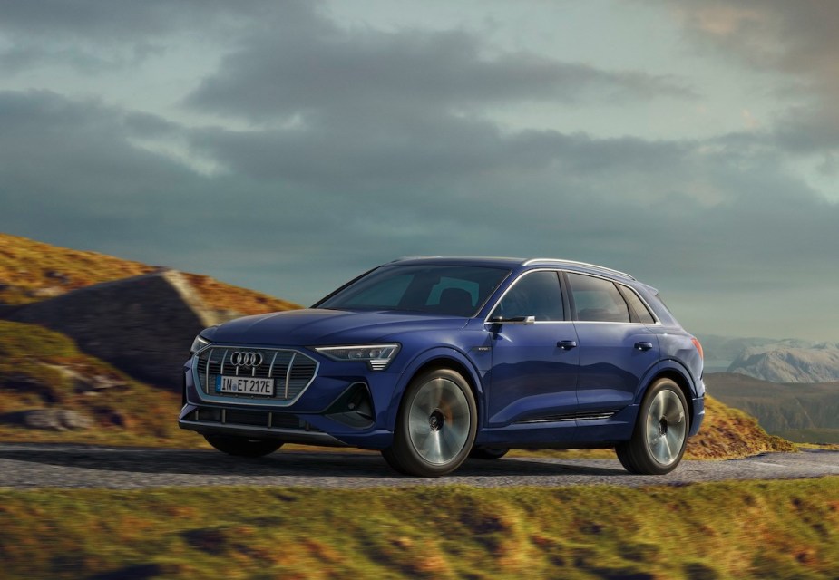 A blue Audi e-tron parked outdoors.