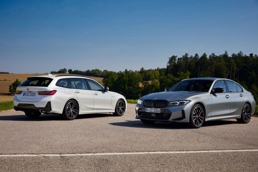 The new white BMW 3 Series Touring and gray BMW 3 Series Sedan models