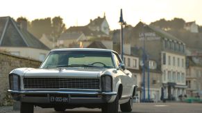 A Buick Riviera model parked at Port-en-Bessin-Huppain in Normandy, France