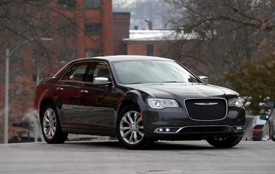 A black Chrysler 300 parked outdoors. 