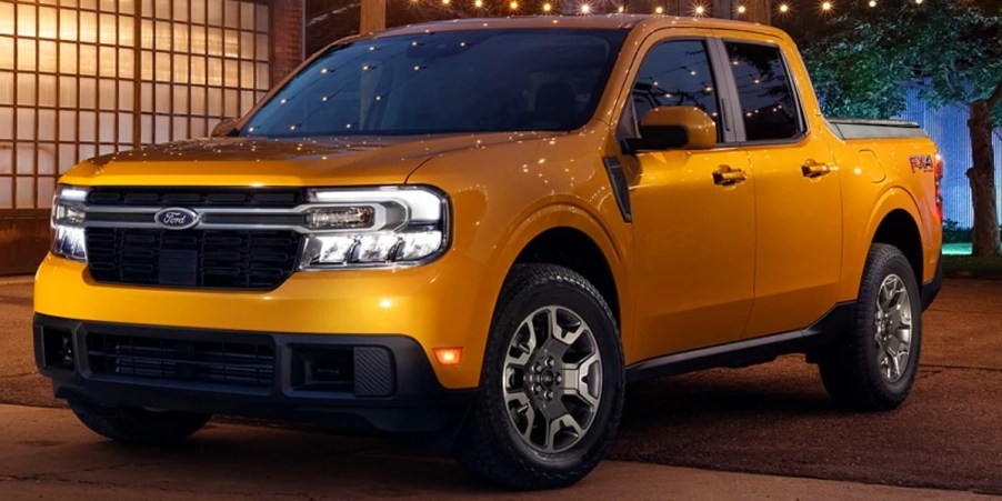 A yellow 2023 Ford Maverick small pickup truck is parked.