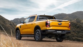 A yellow Ford Ranger in a mountainous area.