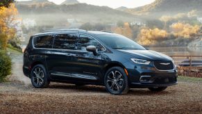 Front angle view of black 2023 Chrysler Pacifica, best new minivan to buy in 2023, says Car and Driver