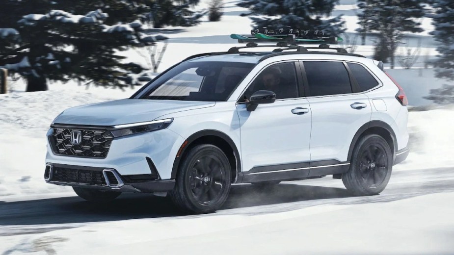 Front angle view of white 2023 Honda CR-V Hybrid crossover SUV