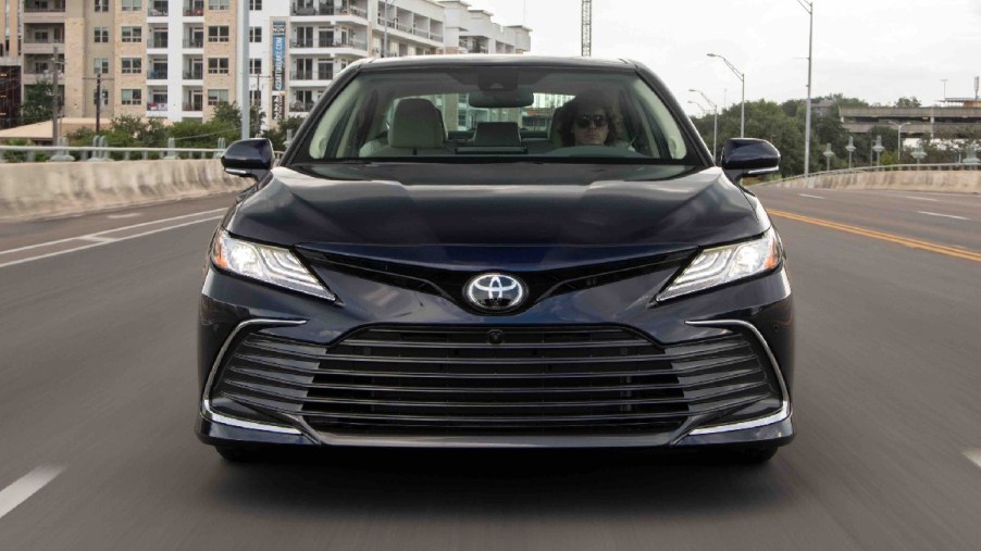 Front view of dark blue 2023 Toyota Camry midsize sedan