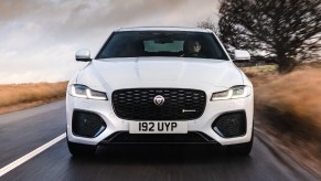 Front view of white 2023 Jaguar XF sports sedan, cheapest new Jaguar and a midsize luxury car bargain