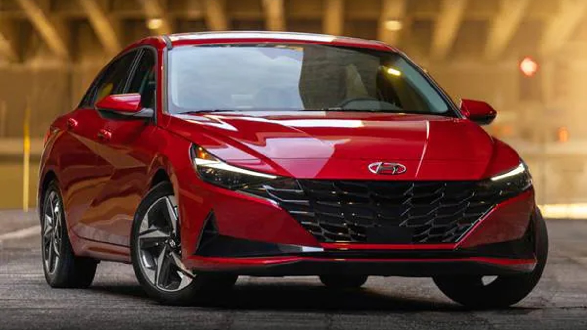 A red Hyundai Elantra Hybrid on display.