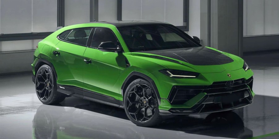 A green Lamborghini Urus Performante small luxury performance SUV is parked.