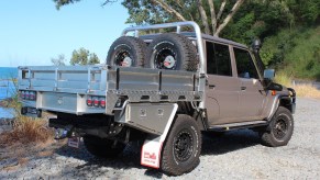 This is a Toyota Land Cruiser truck with an aluminum aftermarket Australian-style utility or ute bed made by NorWeld.