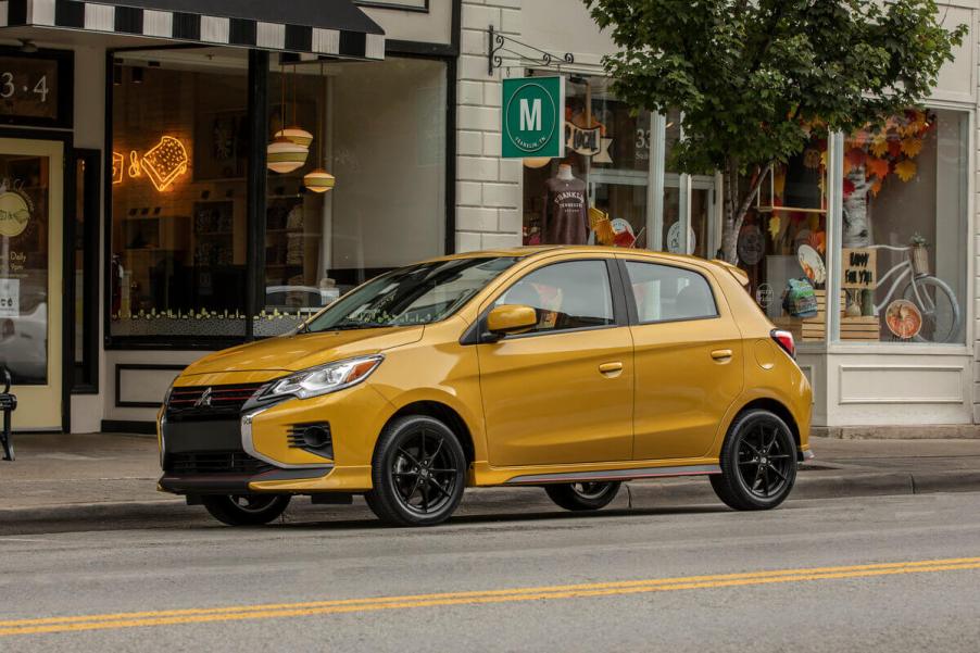 The cheapest car in the automaker's lineup, a 2023 Mitsubishi Mirage sits outside a restaurant.