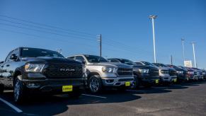 Ram 1500 full-size pickup truck models on the Mak Haik dealership lot in Houston, Texas