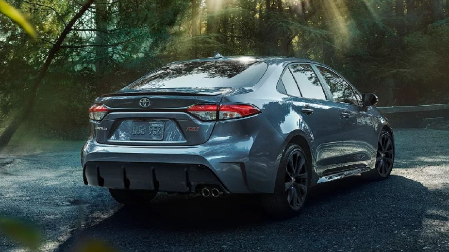 Rear angle view of blue 2023 Toyota Corolla compact sedan