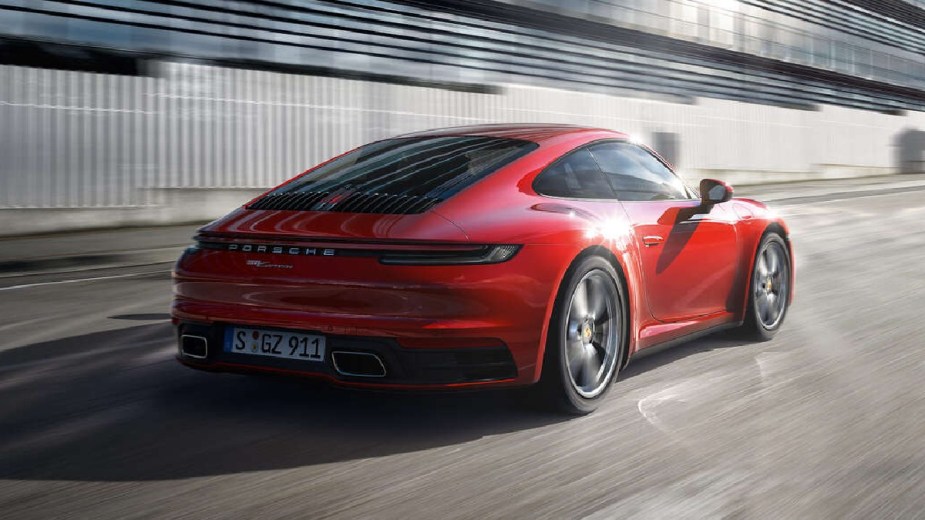 Rear angle view of red 2023 Porsche 911, highlighting the most common problems reported by owners