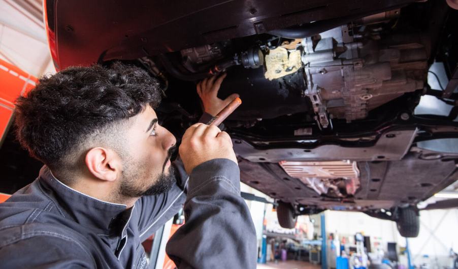 A mechanic possibly fixing an already recalled repair