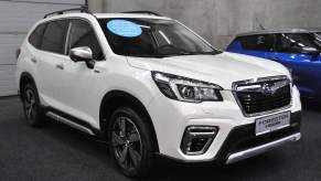 A white Subaru Forester parked indoors. Some of the best Subaru Forester qualities can help you make an informed decision.