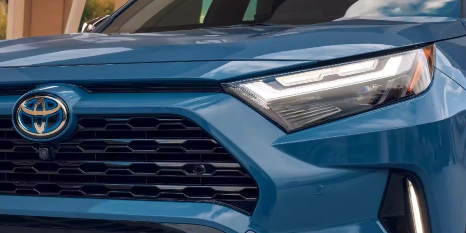 The front of a blue 2023 Toyota RAV4 Hybrid small hybrid SUV.