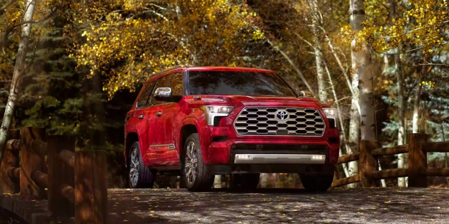 A red 2023 Toyota Sequoia full-size SUV is parked. 