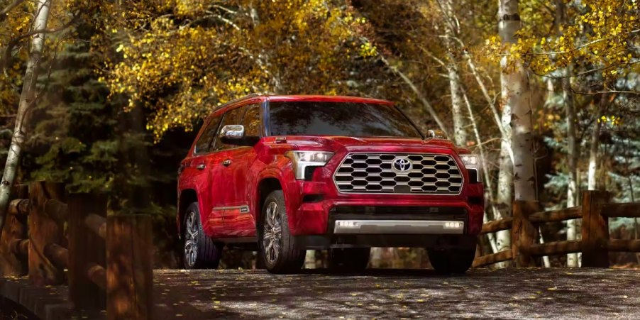 A red 2023 Toyota Sequoia full-size SUV is parked.